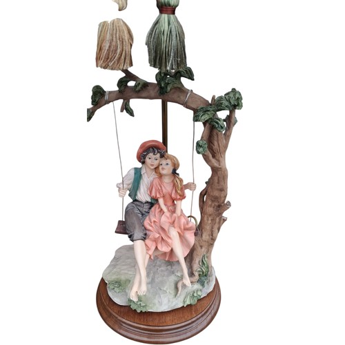 66 - A FIGURINE LAMP