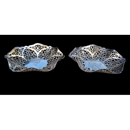 A PAIR OF IRISH SILVER BASKETS WITH ADDITIONAL HALLMARK