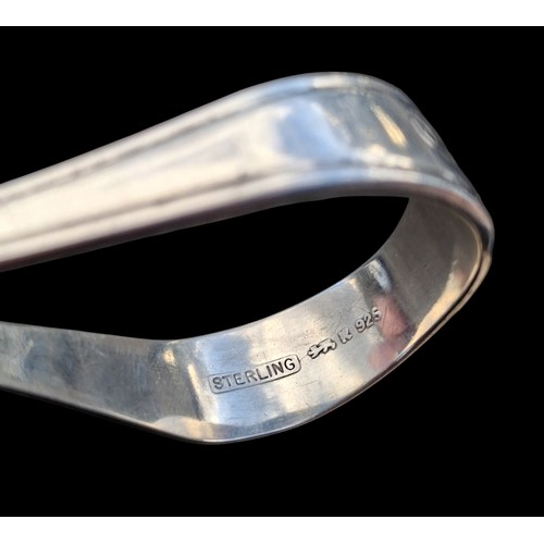 A STERLING SILVER FEEDING SPOON 17.5g