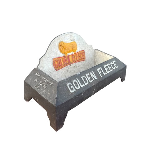 A GOLDEN FLEECE CAST IRON ADVERTISING DOG WATER BOWL