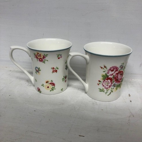 128 - Selection of Mugs and Blue Vase (5)

To include Cath Kidson, V & A and Guernsey Pottery