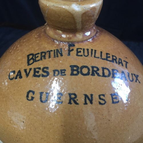 151 - Guernsey Interest: Bertin Feuillerat. Caves de Bordeaux, Guernsey printed on glazed Stoneware Flagon... 