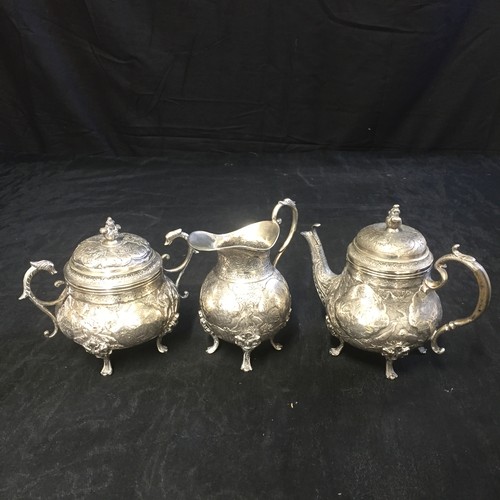 180 - Three Silver Items - Coffee Pot, Sugar Pot & Jug. Not Hallmarked. Potentially Far East Origin.

1259... 