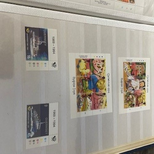 339 - Stamp Albums x 4 
to include Guernsey Jersey & Christmas Editions - unchecked