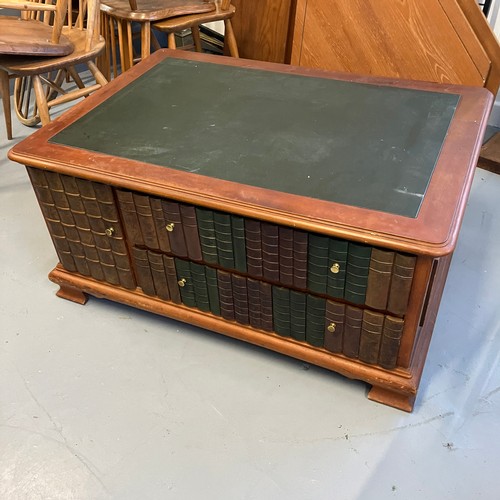 143 - Coffee Table With Fake Book detail reviling two Drawers and a small cupboard.

Size: 103cm Wide, x 7... 