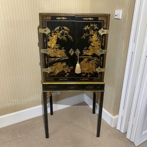 88 - Early George III Japanned Cabinet on Stand. Cupboard doors decorated with a hen protecting her chick... 