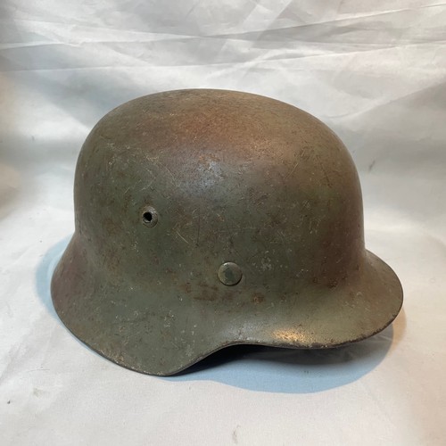 7 - World War II German M-35 Single Decal Steel Helmet
(Decal touched up) with Strap and Liner
Size 58
N... 