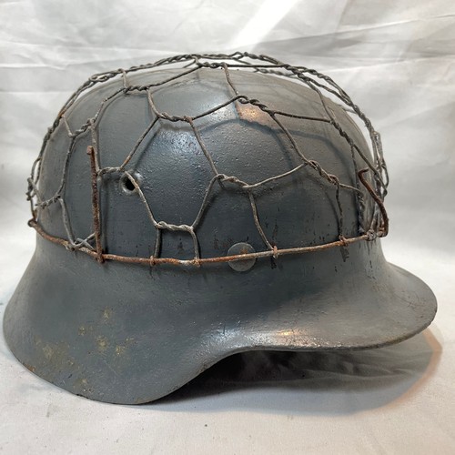 15 - World War II German M-40 Single Decal Helmet
Decal Painted with Wire, Strap and Liner
Name of Wearer... 