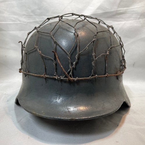 15 - World War II German M-40 Single Decal Helmet
Decal Painted with Wire, Strap and Liner
Name of Wearer... 