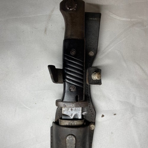 26 - K98 Bayonet with its scabbard and leather frog.  
Matching number 348 on the bayonet and scabbard
Ma... 