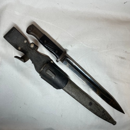 26 - K98 Bayonet with its scabbard and leather frog.  
Matching number 348 on the bayonet and scabbard
Ma... 