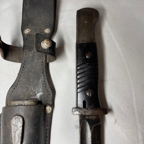 26 - K98 Bayonet with its scabbard and leather frog.  
Matching number 348 on the bayonet and scabbard
Ma... 