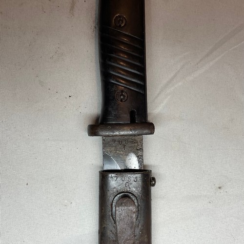 29 - K98 Bayonet with scabbard and its leather frog.  
Matching number 7854 on the bayonet and scabbard.
... 