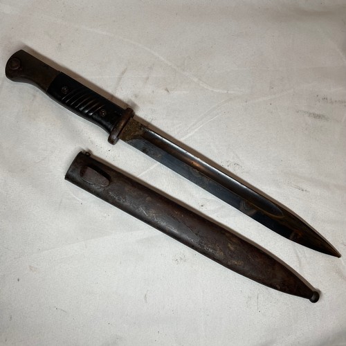 29 - K98 Bayonet with scabbard and its leather frog.  
Matching number 7854 on the bayonet and scabbard.
... 