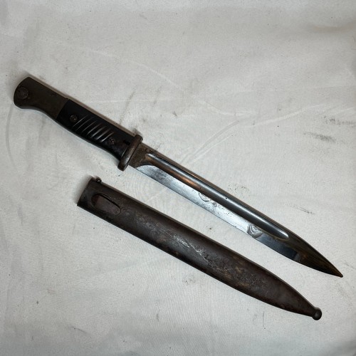 29 - K98 Bayonet with scabbard and its leather frog.  
Matching number 7854 on the bayonet and scabbard.
... 