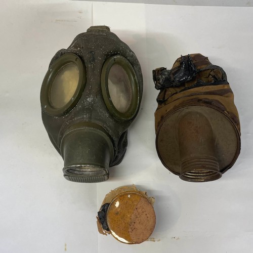 99 - A pair of World War II German Gas Masks with Spare Lenses