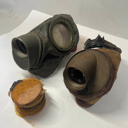 99 - A pair of World War II German Gas Masks with Spare Lenses