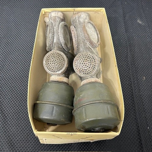 206 - A Pair of World War II Gas Masks and Filters.