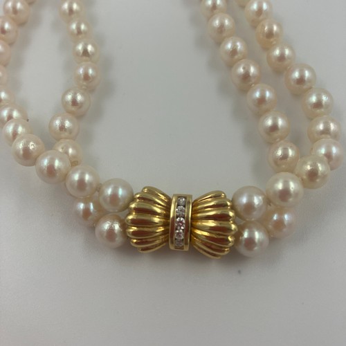 4 - Japanese Cultured Pearls, 5.5mm High Lustred in Uniform Shape Twin Strands Knotted and set with an 1... 