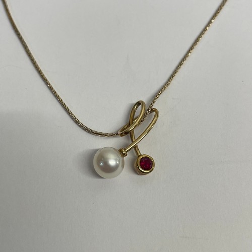 30 - 9ct Gold Necklace & Pendant With Pearl & Small Ruby 
(Both Marked 375)

Total Weight: 3.05g