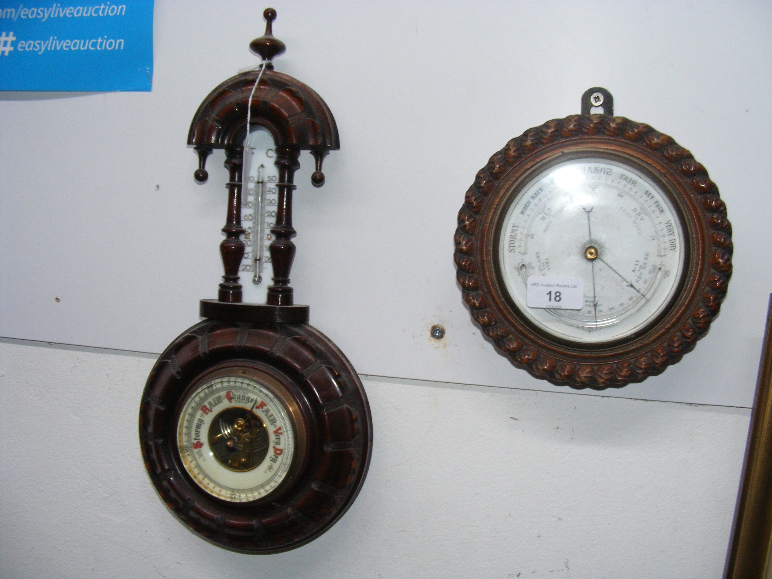 An antique wall barometer/thermometer in rope twist surround, together ...