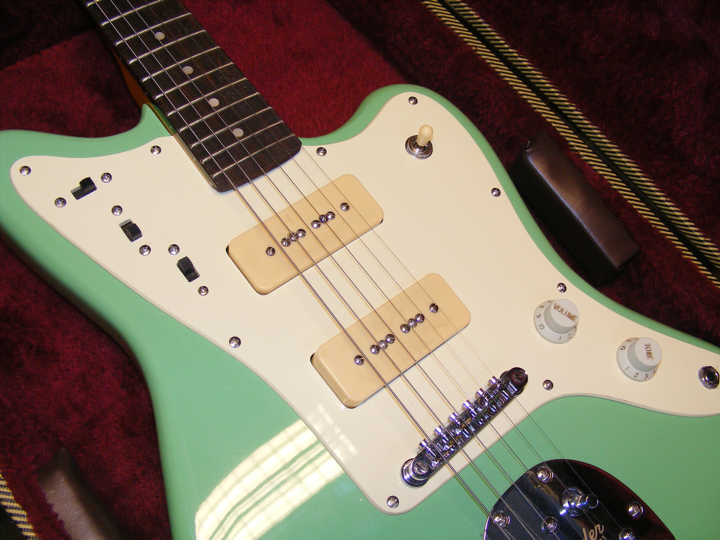 A Fender Jazzmaster six string electric guitar with carrying case