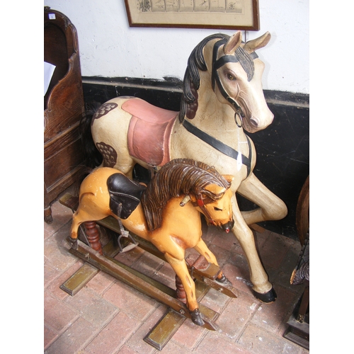 A hand painted wooden horse - 96cm high, together with a 66cm high ...