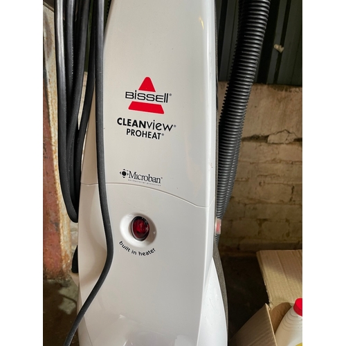 342 - Working Bissell Cleanview Proheat Carpet Cleaner + Box of cleaning products