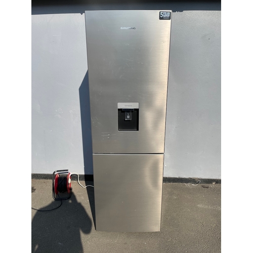 357 - Working Grundig Stainless Fridge Freezer - some cosmetic damage as shown 
61cm x 60cm x 183cm 
Water... 