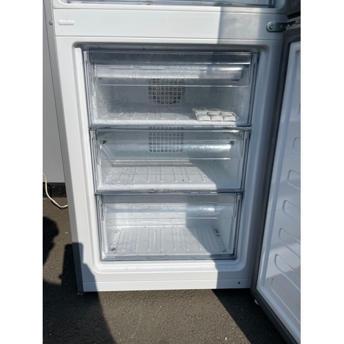 357 - Working Grundig Stainless Fridge Freezer - some cosmetic damage as shown 
61cm x 60cm x 183cm 
Water... 