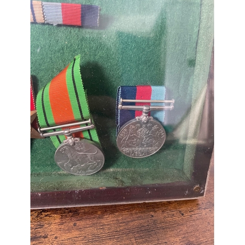 193 - Framed Collection of Five WW2 Military Medals inc Bedford & Hertford, The Queens, Royal Sussex Regim... 