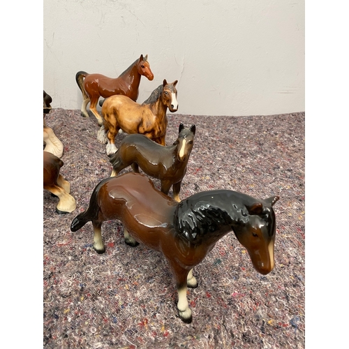 102 - Collection of porcelain horse / shire ornaments