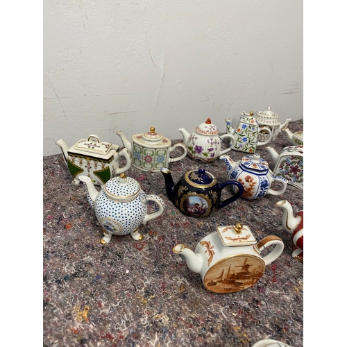 106 - Collection of 26 Porcelain Art Miniature Tea pots with tags all in very good order