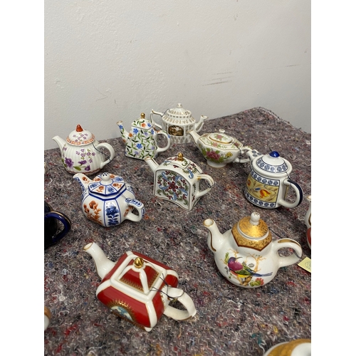 106 - Collection of 26 Porcelain Art Miniature Tea pots with tags all in very good order