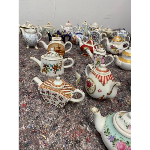 106 - Collection of 26 Porcelain Art Miniature Tea pots with tags all in very good order