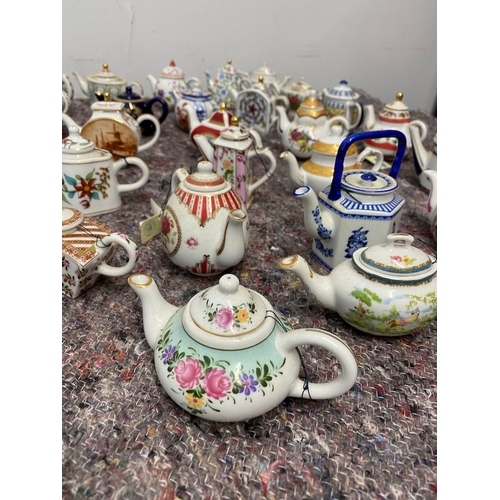 106 - Collection of 26 Porcelain Art Miniature Tea pots with tags all in very good order