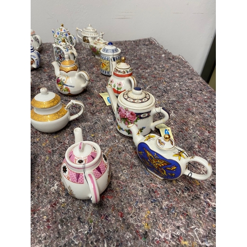 106 - Collection of 26 Porcelain Art Miniature Tea pots with tags all in very good order