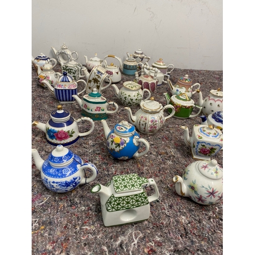 107 - Collection of 27 Porcelain Art Miniature Tea pots with tags all in very good order