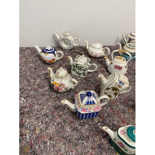 107 - Collection of 27 Porcelain Art Miniature Tea pots with tags all in very good order