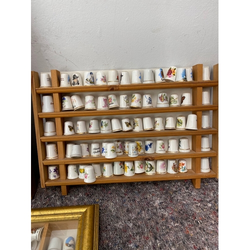 94 - Collection of 5 framed collectable / advertisement thimbles approx 250/300