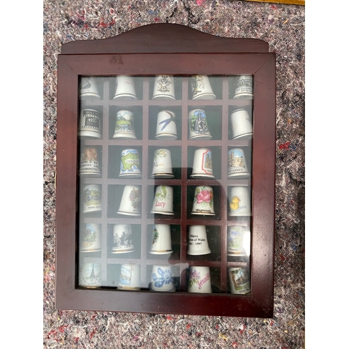 94 - Collection of 5 framed collectable / advertisement thimbles approx 250/300