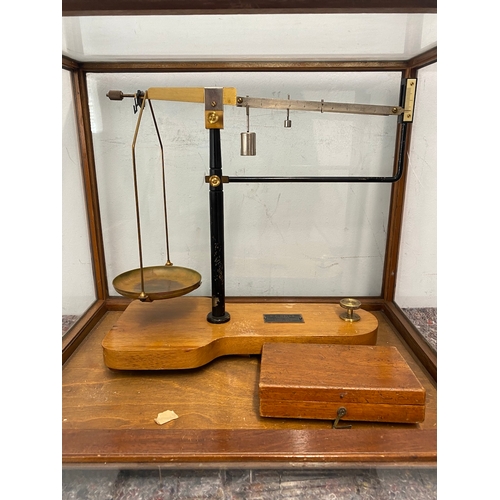 118 - Vintage cased laboratory balance scales by G F Wells - damage to one panel of glass