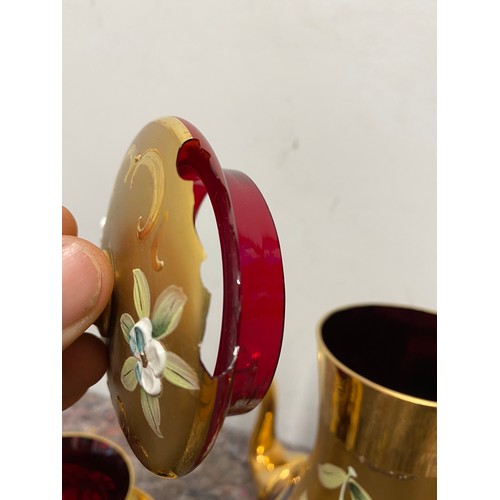 166 - Vintage cranberry and gilded glassware tea set - damage to lid on tea pot