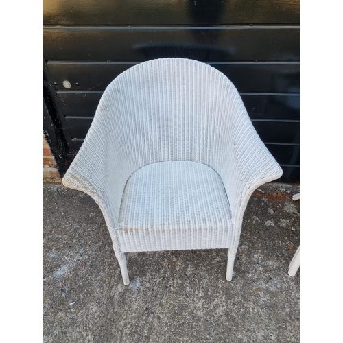 275 - Two vintage white whicker armchairs