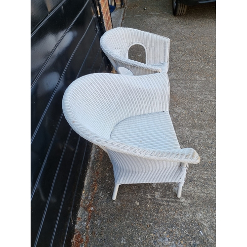 275 - Two vintage white whicker armchairs