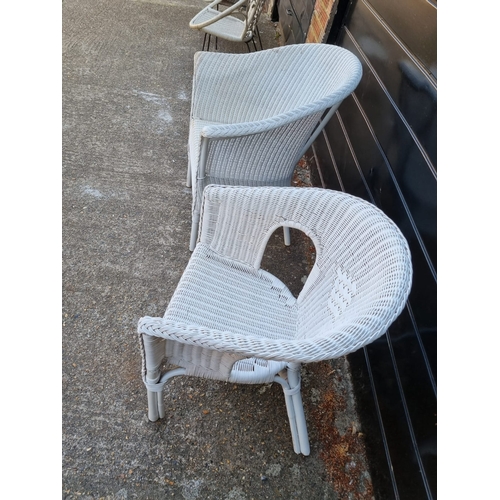 275 - Two vintage white whicker armchairs