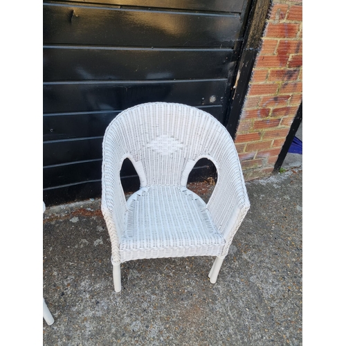 275 - Two vintage white whicker armchairs