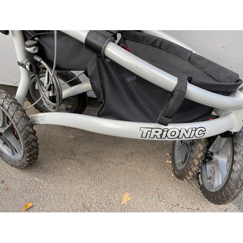 132 - Trionic Veloped Tour Walker in excellent condition comes with pump and lock - 14 inch wheels need pu... 