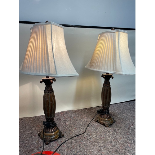 128 - Pair of matching Resin lamps in art nouveau style - working - one has damage to top as shown - 76cm