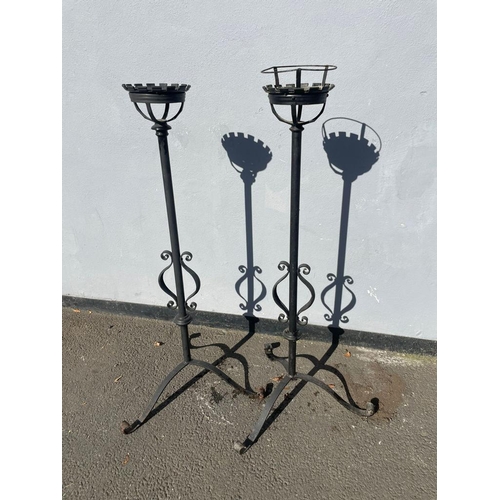 383 - A vintage pair of wrought iron garden candle stick holders